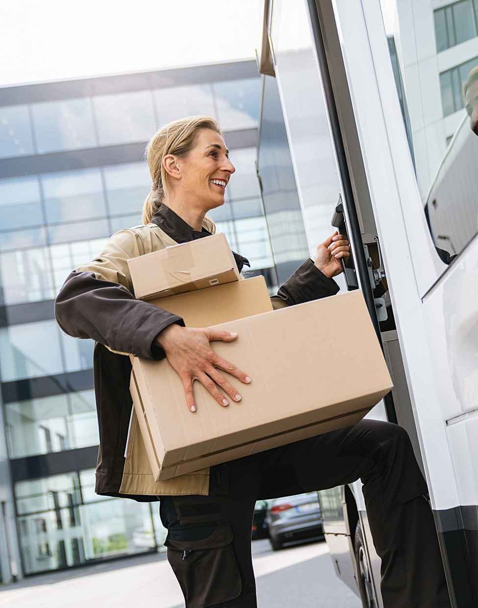 logistic employee holding a parcel delivery